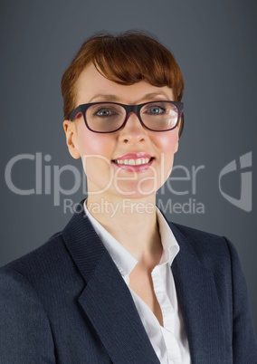 Close up of business woman smiling against grey background