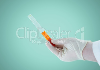 Gloved hand with tube against aqua background