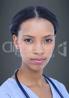 Close up of female doctor against grey background