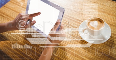 Businessman touching screen of tablet PC by coffee
