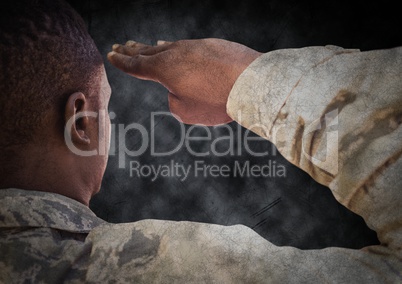 Back of soldier saluting with black grunge background and overlay