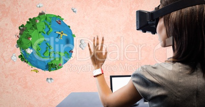 Businesswoman wearing VR glasses with low poly earth in background