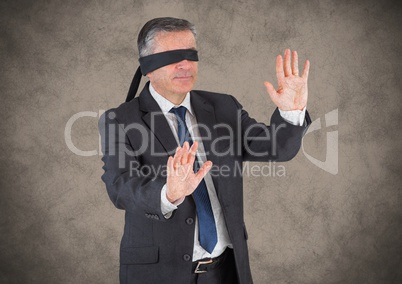 Business man blindfolded with grunge overlay and brown background