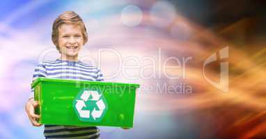 Little boy carrying recycle container