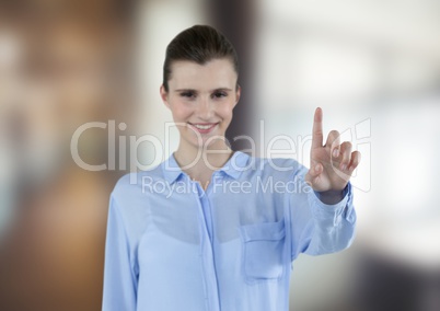 Happy businesswoman touching futuristic screen
