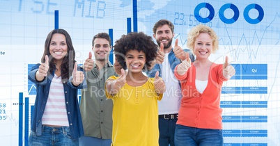 Confident business people showing thumbs up sign against graphs