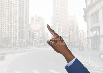 Hand pointing in  air of city