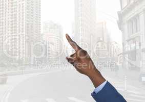 Hand pointing in  air of city