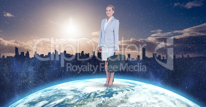 Businesswoman standing on globe