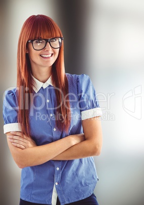 Portrait of smiling redhead woman with arms crossed