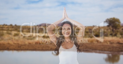 Double exposure of woman exercising by lake