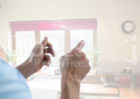 Hand touching glass screen at home