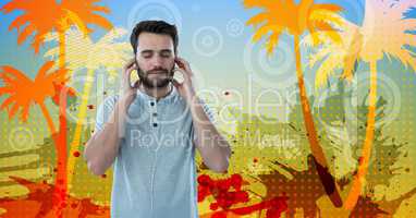 Young man listening to music through earphones