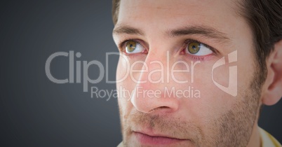 Close up of man's sad face against grey background