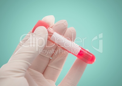 Gloved hand with red container against aqua background