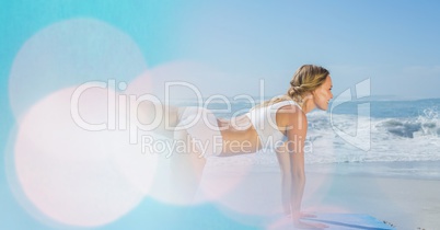 Young woman exercising at beach
