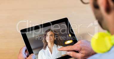 Cropped image of man video conferencing with woman on tablet PC