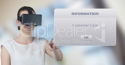 Smiling woman wearing VR glasses while touching information box