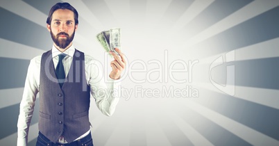 Hipster holding money against bright background