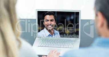 Man and woman having video call on laptop