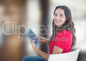 Portrait of woman smiling while using tablet PC