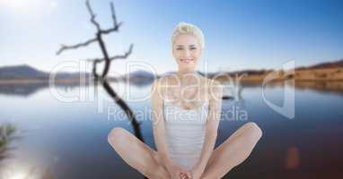 Double exposure of woman performing yoga at lake shore