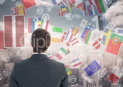 flags flaying in the city with connections. business man looking to it