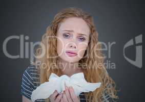 Woman with tissues against grey background