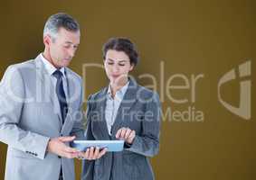 Business people using tablet PC over colored background