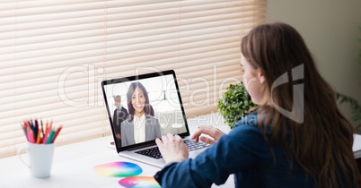 Businesswoman video conferencing in office