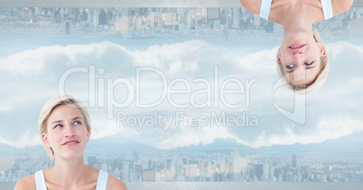 Digital composite image of upside down woman in city