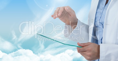 Doctor touching glass with cloudy sky