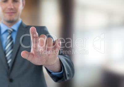 Businessman touching screen in office