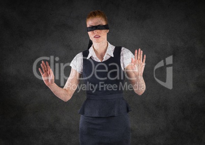 Business woman blindfolded with grunge overlay against grey wall
