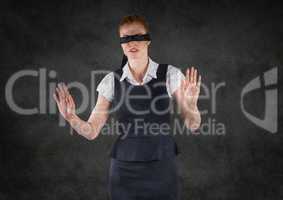 Business woman blindfolded with grunge overlay against grey wall