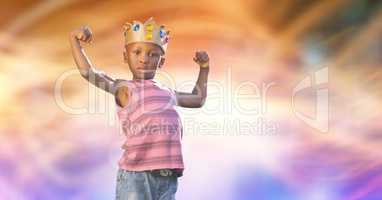 Portrait of kid wearing crown while flexing muscles