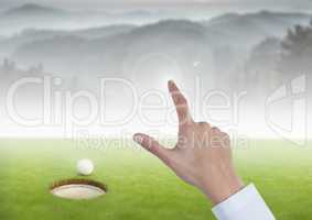 Womans Hand touching golf course mountains