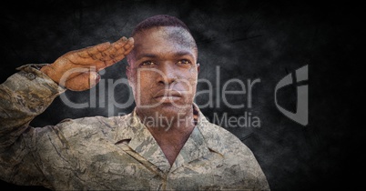 Soldier saluting with black grunge background and overlay