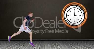 Fit man running with clock in background
