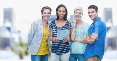 Smiling business people with tablet PC outdoors