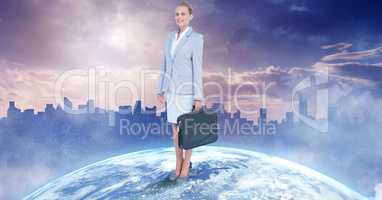 Confident businesswoman standing on globe