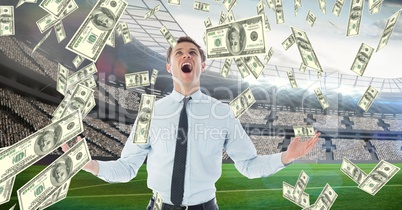 Businessman screaming while looking at money falling representing football corruption