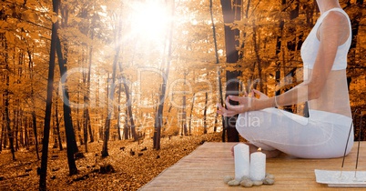 Double exposure of woman meditating in forest during autumn