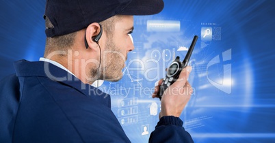 Security guard using radio against screen