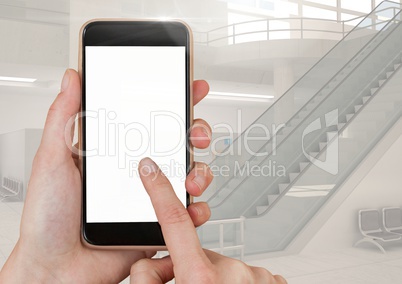 Hand touching mobile phone with airport background