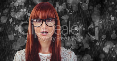 Surprised woman wearing eyeglasses on rainy day