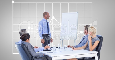Businessman giving presentation to colleagues against graph