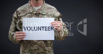 Soldier volunteer mid section against navy chalkboard