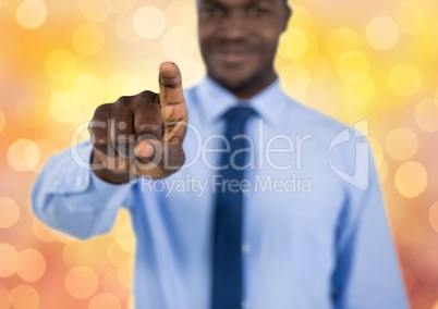 Businessman touching screen over bokeh