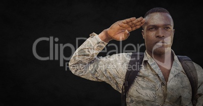 Soldier with backpack saluting against black background with grunge overlay
